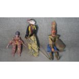 Three vintage puppets, including an Oriental painted wood and fabric puppet and a papier mache