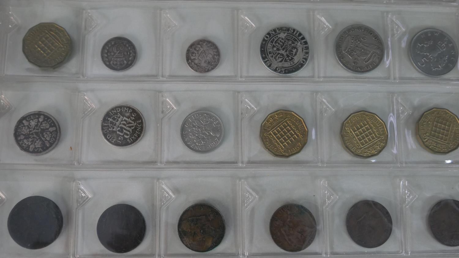 An album of world stamps along with a British Collecta coin album filled with various British coins. - Image 14 of 15