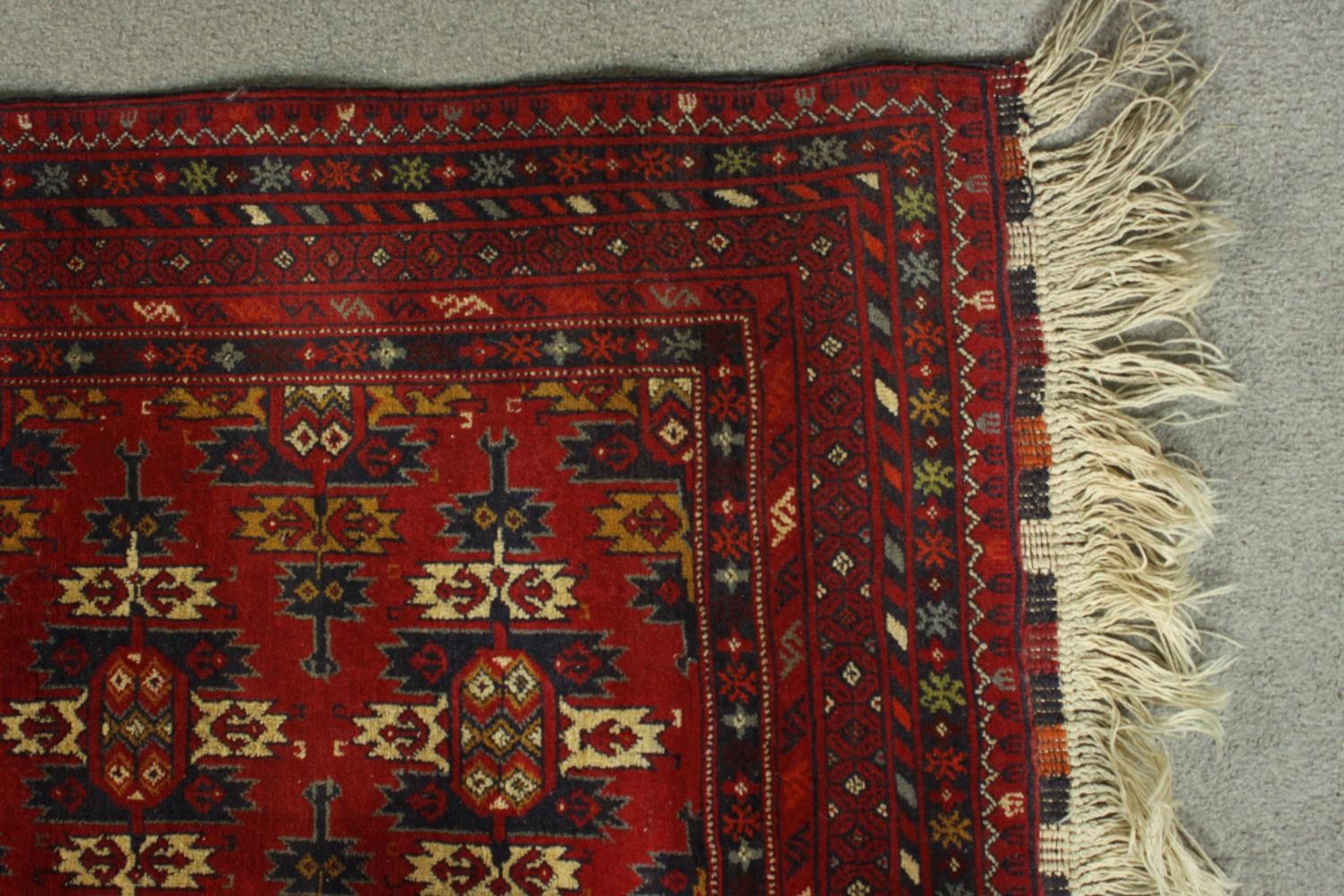 A hand made red ground Ankhoi Afghan rug. L.150 W.87cm. - Image 4 of 5