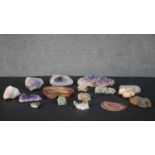 A collection of gemstones and minerals, including amethyst, agate, rock crystal and corrundum. L.