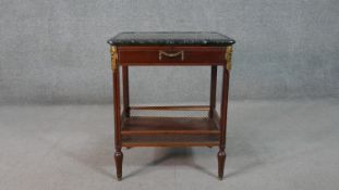 A French Directiore style mahogany gueridon table, with a green marble top, over a single drawer, on
