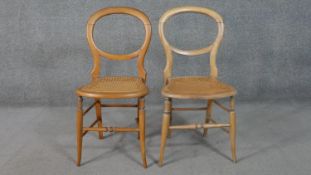A 19th century balloon back chair along with a similar chair.