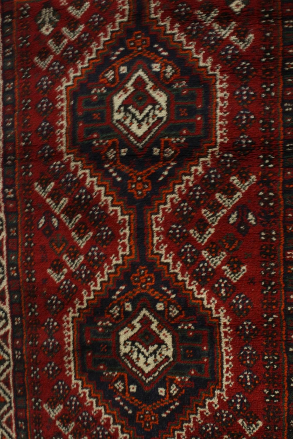 A hand made red ground Shiraz rug. L.130 W.82cm. - Image 3 of 6