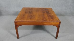A Georgian style yew wood and crossbanded coffee table. H.46 W.91 D.91cm