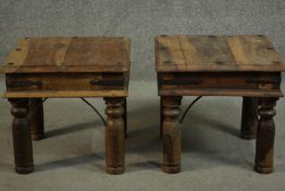 A pair of small Indian sheesham wood coffee tables, the square top with studded details, over iron