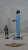 An Art Deco carved and painted period bell-boy dumb waiter along with a carved tribal figure and a