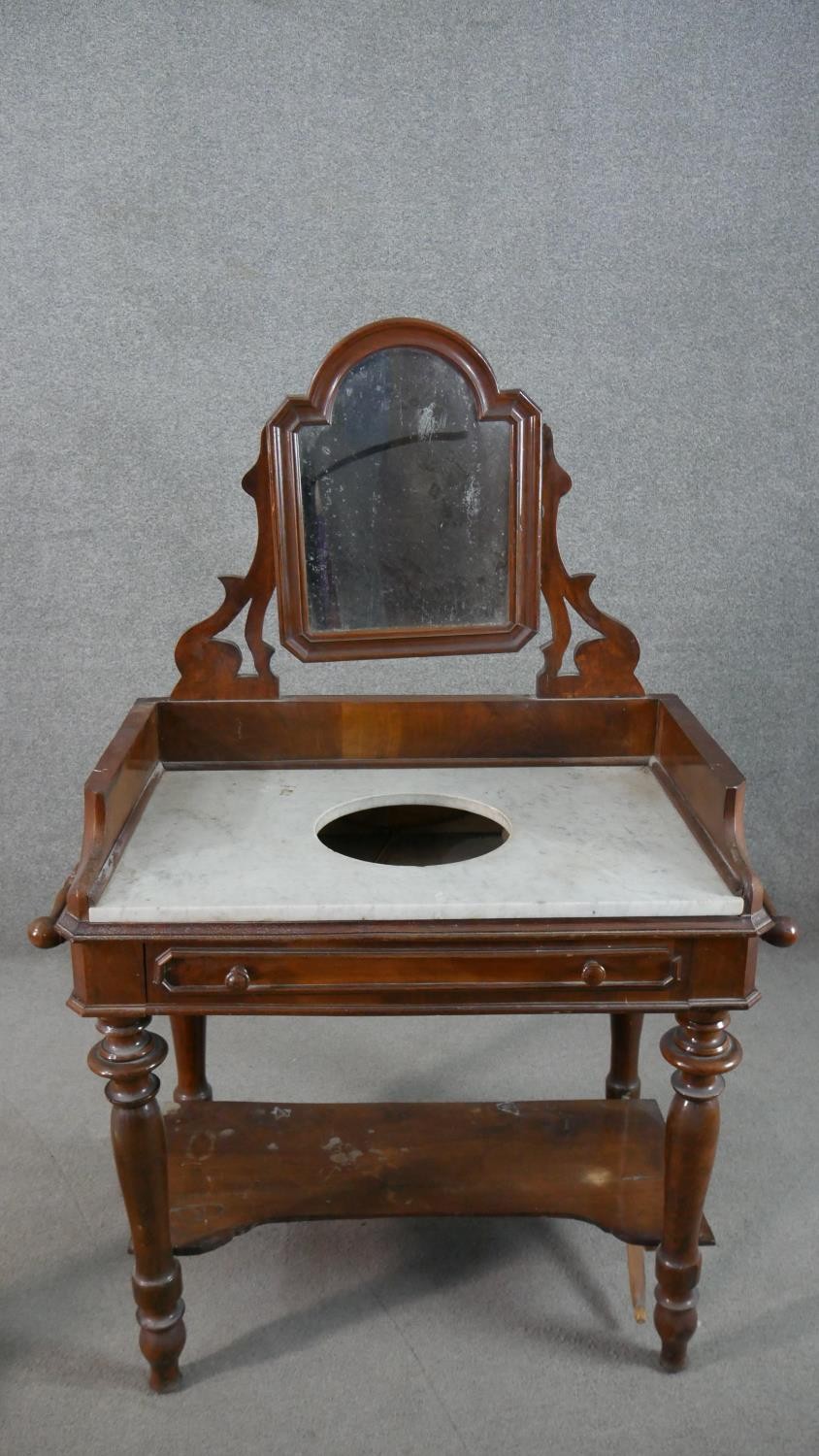 A 19th century mahogany washstand, fitted with swing mirror over a white marble top, above a - Image 2 of 12