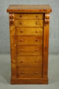 A Victorian pine Wellington chest of seven drawers with locking bar, on a plinth base. H.112 W.58