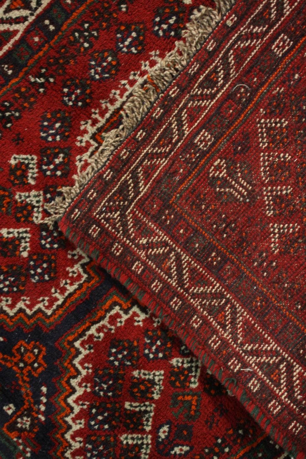 A hand made red ground Shiraz rug. L.130 W.82cm. - Image 5 of 6