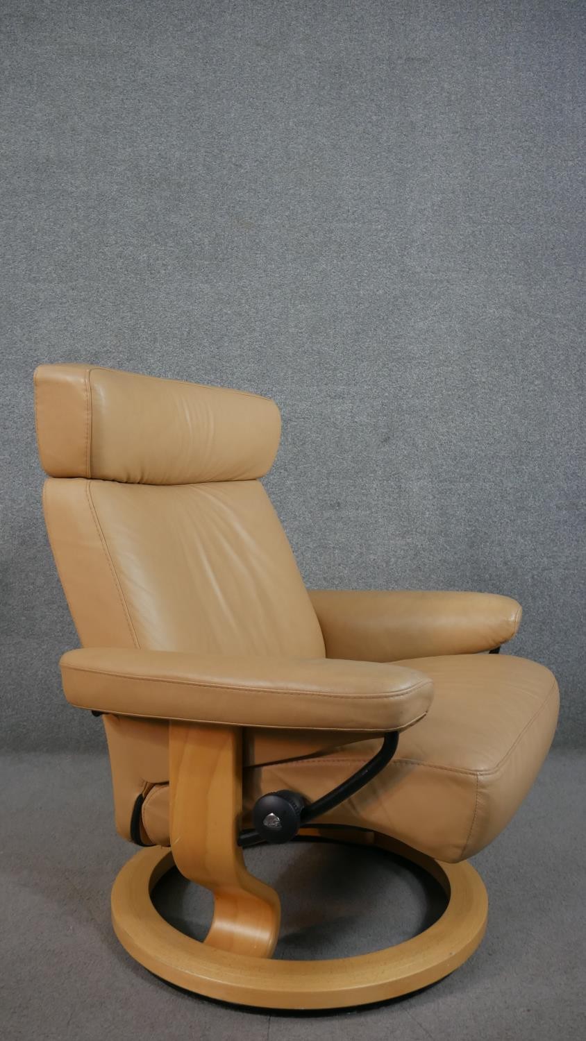 A Norwegian Ekornes Stressless chair & stool, upholstered in tan leather, with a beech frame, on - Image 5 of 11