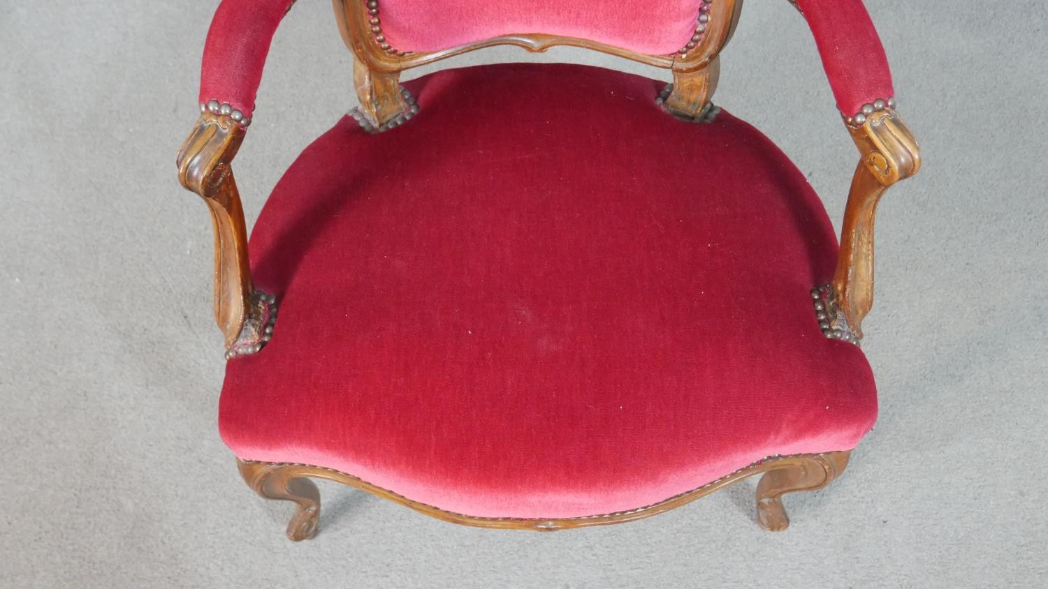 A pair of French walnut Louis XV style fauteuil armchairs, upholstered in red fabric to the back, - Image 4 of 7