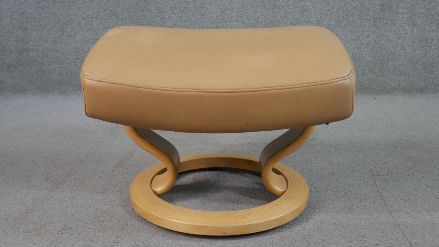 A Norwegian Ekornes Stressless chair & stool, upholstered in tan leather, with a beech frame, on - Image 9 of 11