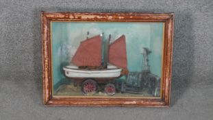 A framed and glazed early 20th century carved and painted model of a Ramsgate Lifeboat on a
