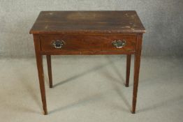 A George III mahogany side table, the rectangular top with reeded edges, over a single drawer, on