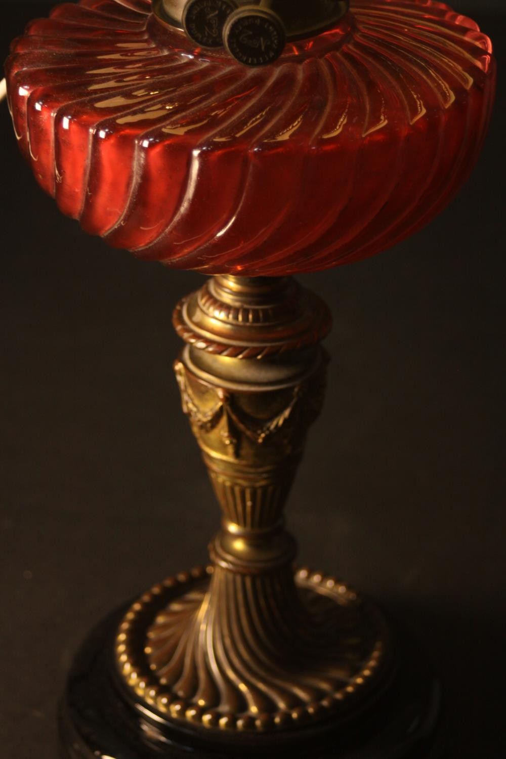 A Victorian oil lamp converted to electricity, with a spherical milk glass shade and a gadrooned red - Image 3 of 4