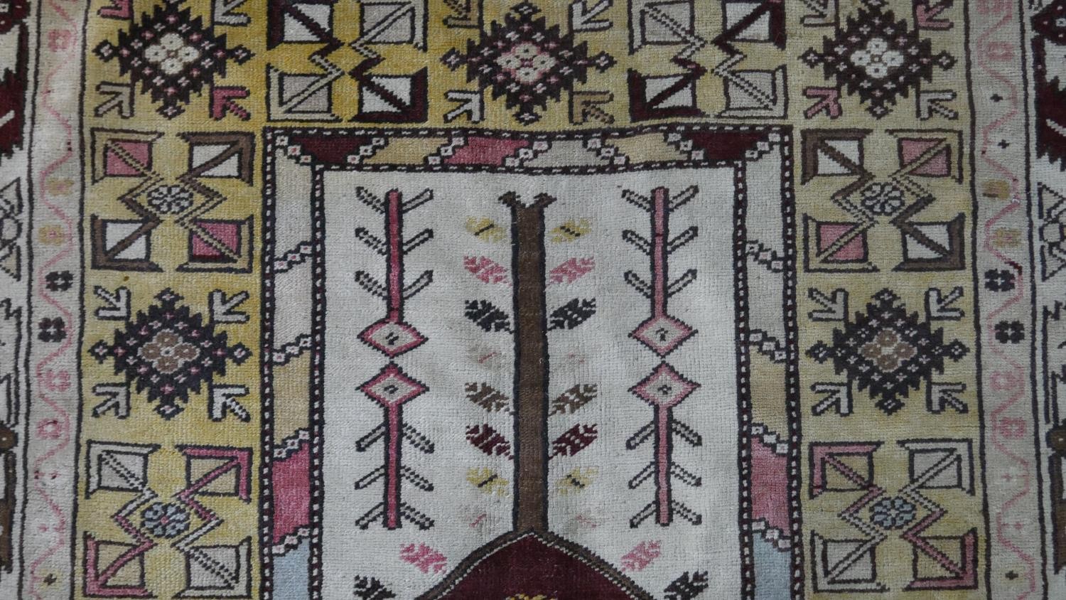 A Turkish Milas rug on a wine ground within stylised multiple borders. L.230 W.127cm - Image 3 of 8