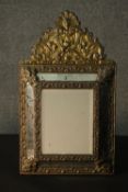 A 19th century Dutch pressed brass wall mirror, of rectangular form, within a marginal frame, with