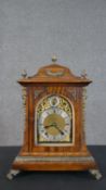 A Breton & Sons, Cork quarter striking walnut and gilt ormolu bracket clock. Gilded dial with silver