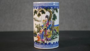 A 19th century Chinese hand painted porcelain brush pot, decorated with figures in a mountainous