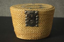 A Chinese lockable woven picnic basket containing blue and white tea pot and two tea bowls. H.20 W.