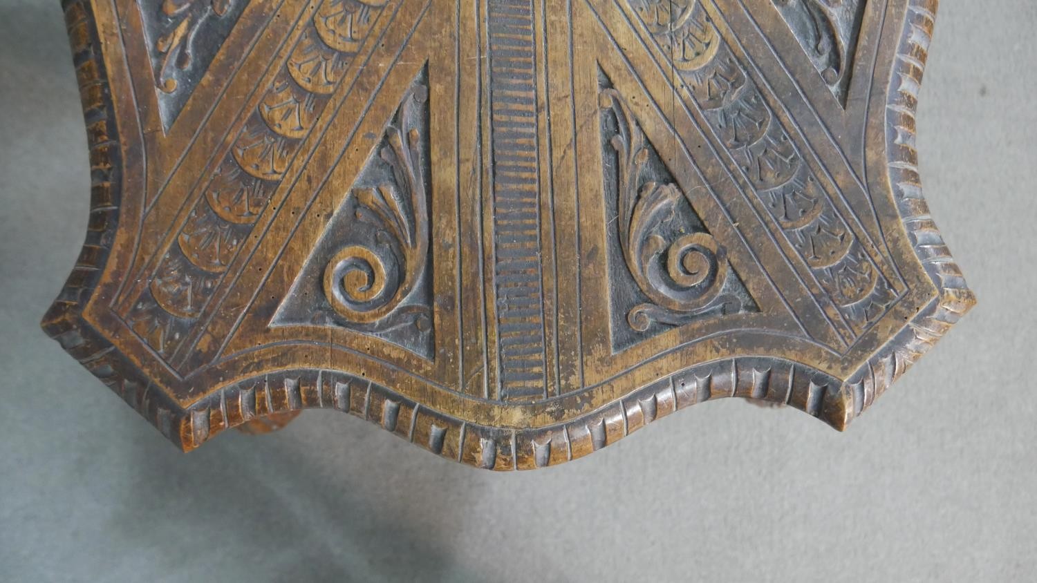 A late 19th century oak occasional table with shaped and carved central medallion raised on - Image 4 of 14