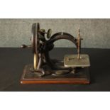 An American Willcox and Gibbs of New York hand sewing machine, with maker's label, on a mahogany