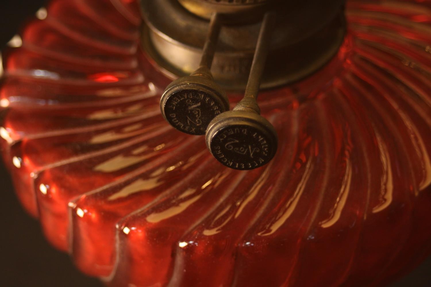 A Victorian oil lamp converted to electricity, with a spherical milk glass shade and a gadrooned red - Image 4 of 4