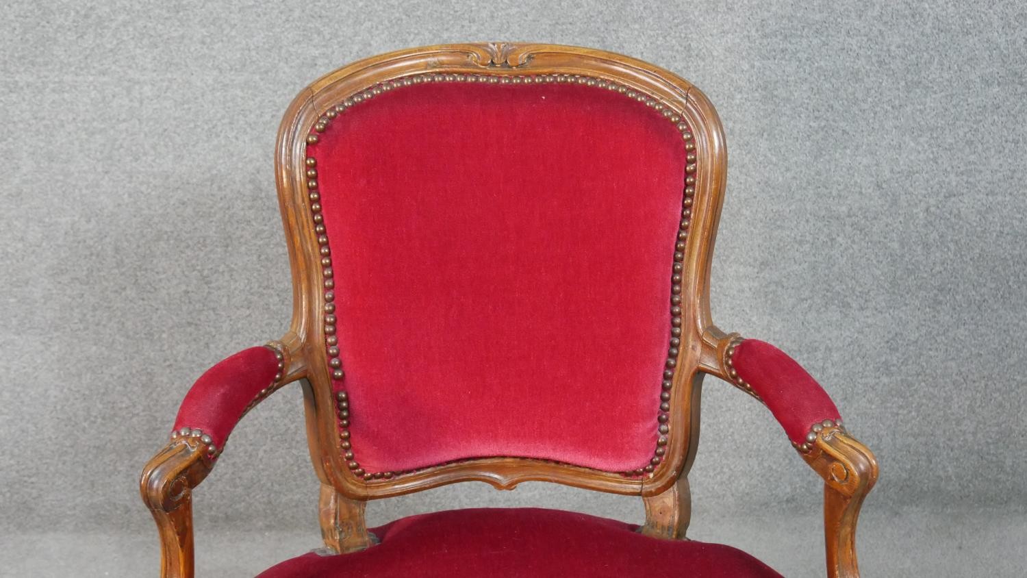 A pair of French walnut Louis XV style fauteuil armchairs, upholstered in red fabric to the back, - Image 5 of 7