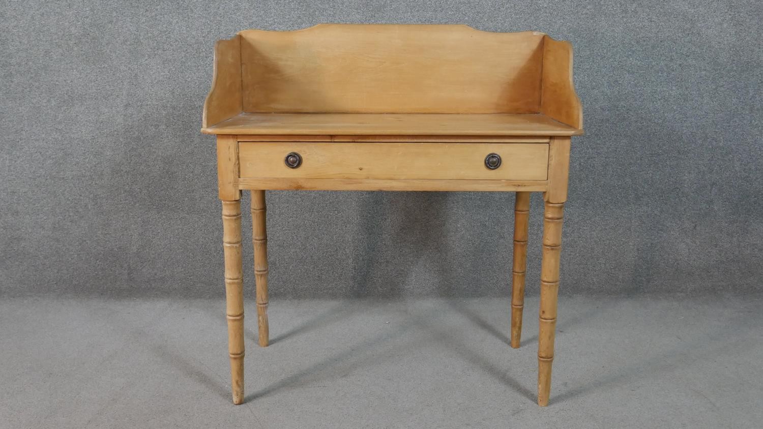 A Victorian pine washstand with raised back and frieze drawer on tapering turned supports. H.47 W.90 - Image 2 of 8