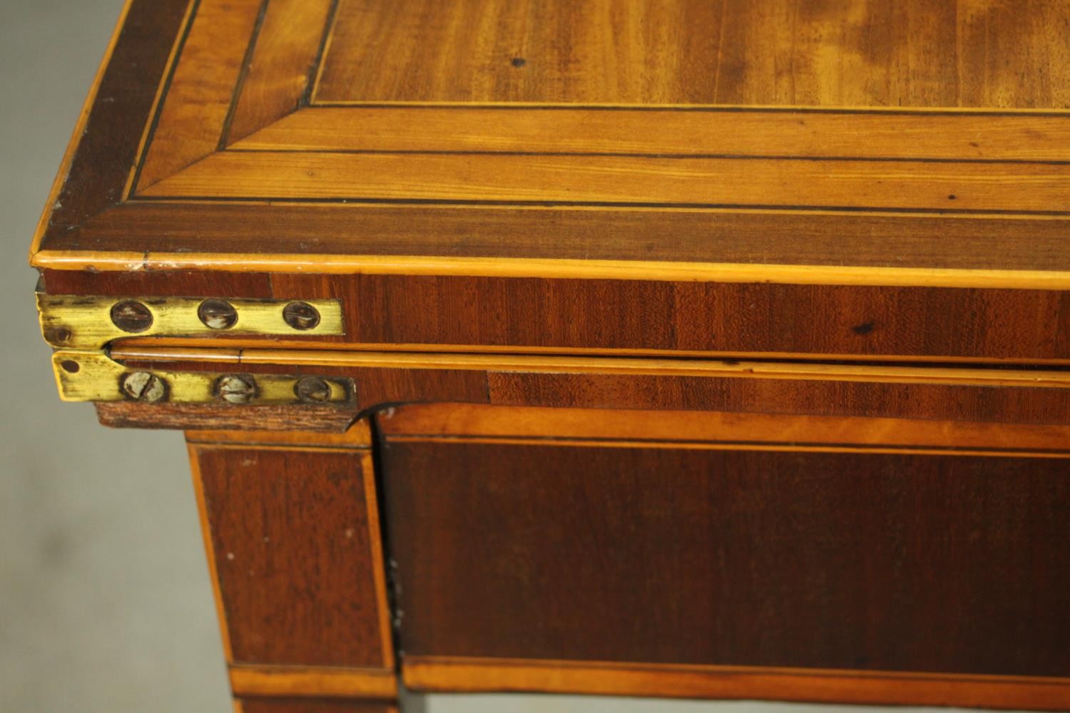 A Sheraton style mahogany card table, the rectangular top with canted corners, crossbanded with - Image 6 of 10