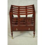A Victorian style mahogany Canterbury, with three dividers, over a single drawer, on turned legs