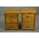 A pair of late 20th century pine bedside chests, of three drawers with knob handles. H.59 W.45. D.