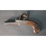 An early 19th century pocket flint lock pistol by George Johnson of Newcastle, engraved detailing to