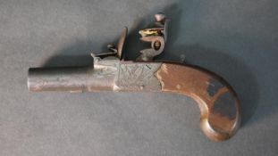 An early 19th century pocket flint lock pistol by George Johnson of Newcastle, engraved detailing to