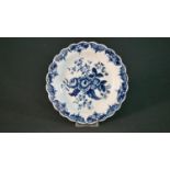 An 18th century Worcester blue and white hand painted floral design plate. Blue crescent mark to the