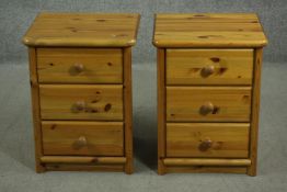 A pair of late 20th century pine bedside chests, of three drawers with knob handles. H.59 W.45 D.