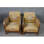A pair of Art Deco adjustable reclining armchairs, upholstered in worn floral fabric with a yellow