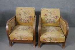 A pair of Art Deco adjustable reclining armchairs, upholstered in worn floral fabric with a yellow