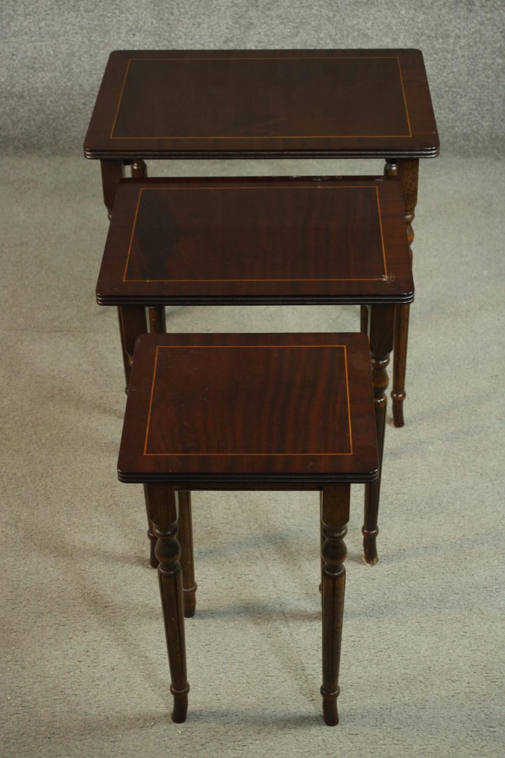 A reproduction mahogany and beech nest of three tables, with rectangular tops on turned and fluted - Image 3 of 7