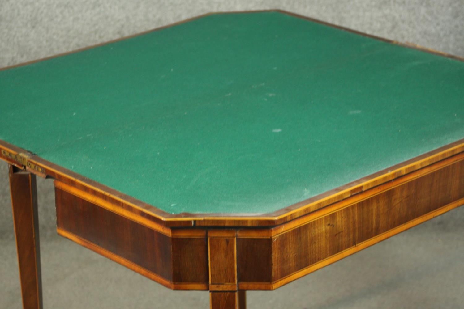 A Sheraton style mahogany card table, the rectangular top with canted corners, crossbanded with - Image 8 of 10