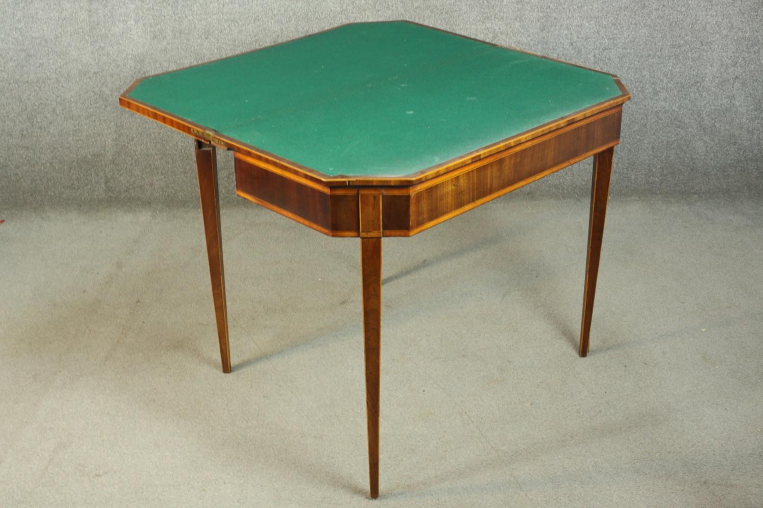 A Sheraton style mahogany card table, the rectangular top with canted corners, crossbanded with - Image 7 of 10