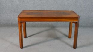 A Brights of Nettlebed reproduction figured walnut coffee table, in 18th century style, of
