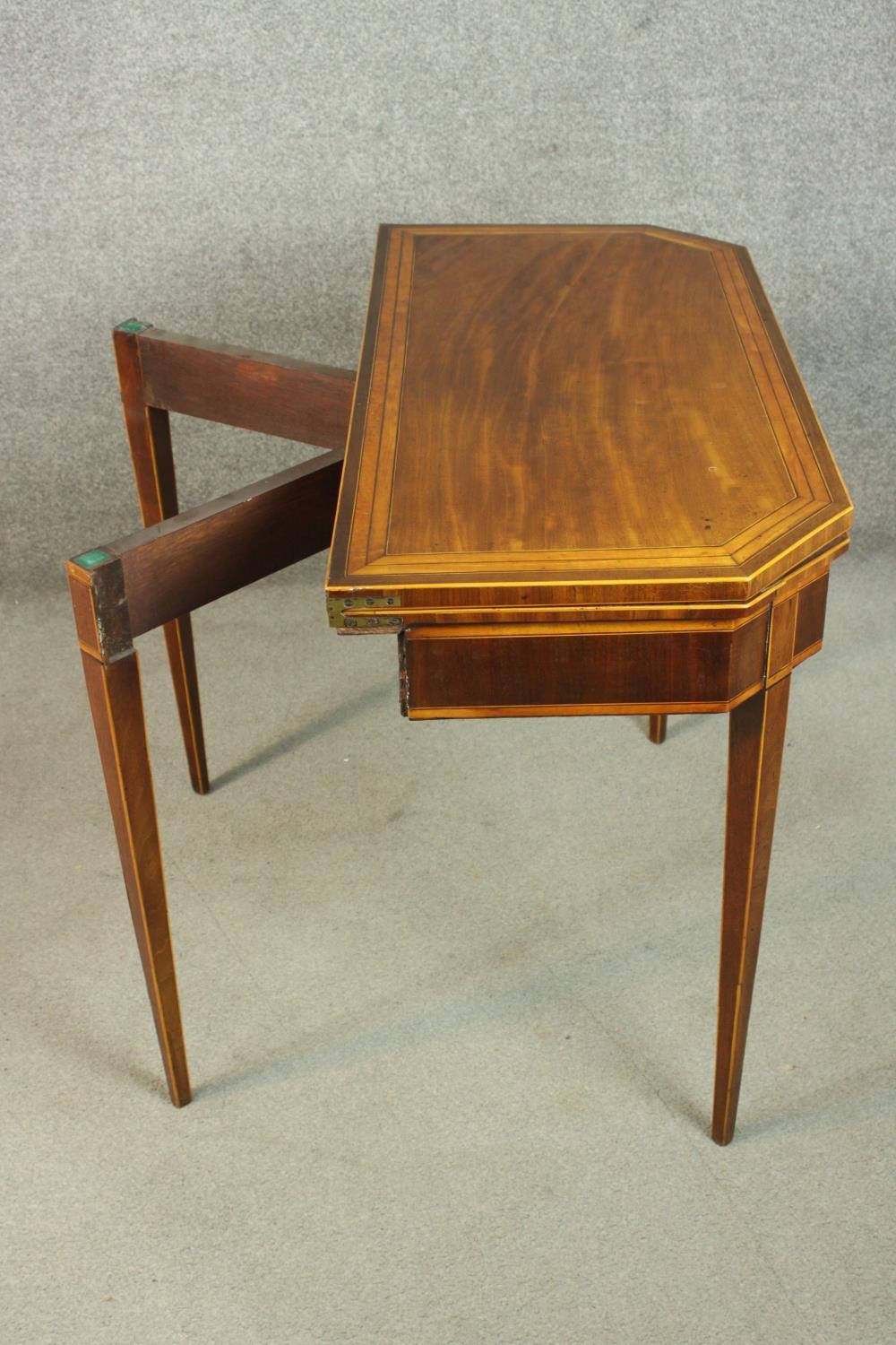 A Sheraton style mahogany card table, the rectangular top with canted corners, crossbanded with - Image 10 of 10