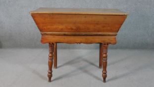 A 19th century elm dough proving bin with lift off panel top on turned tapering supports. H.77 W.