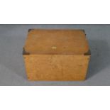 A stained hardwood lidded box with brass fittings containing eight maple veneered framed