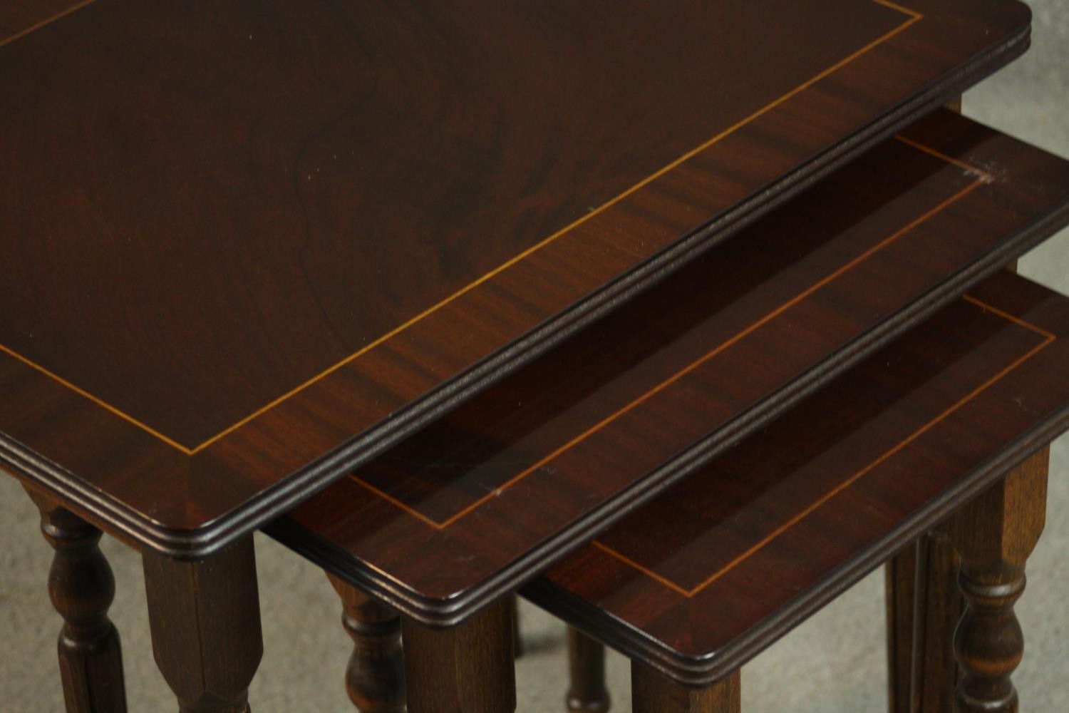 A reproduction mahogany and beech nest of three tables, with rectangular tops on turned and fluted - Image 7 of 7