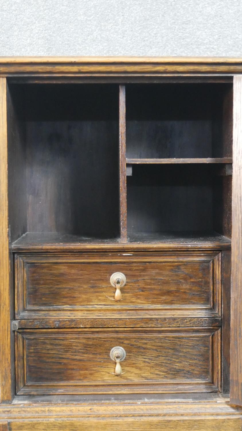 A Jacobean style oak cabinet with lozenge panel door enclosing a fitted interior on a barleytwist - Image 4 of 7