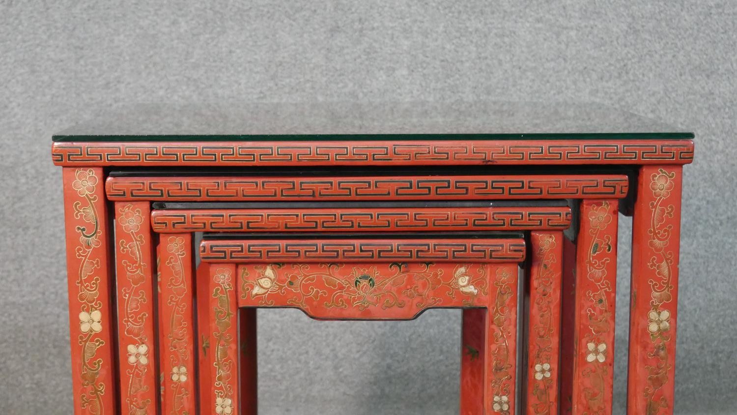 A quartetto of Chinese red lacquered occasional tables, of rectangular form, painted with figures in - Image 6 of 11