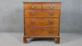 A 19th century mahogany chest of two short over three long graduated drawers, on shaped bracket
