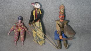 Three vintage puppets, including an Oriental painted wood and fabric puppet and a papier mache